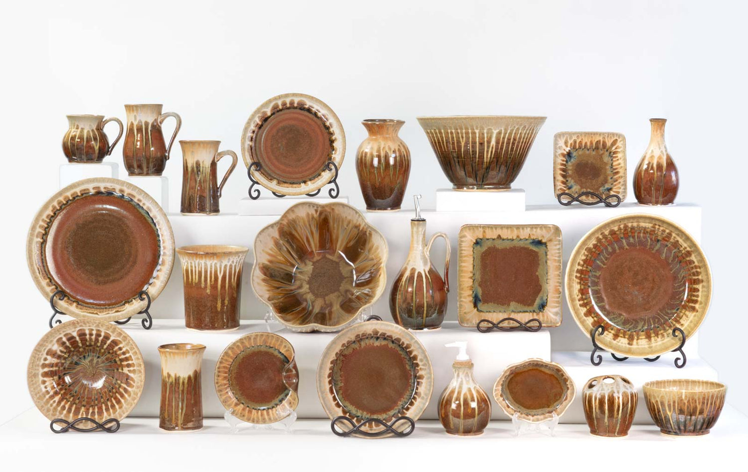 Display of handmade pottery dinnerware & home accessories in Golden Amber Glaze