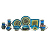handmade ceramic dinnerware set in amber blue glaze, including square plates, round wheel-thrown plates, bowls, and mugs